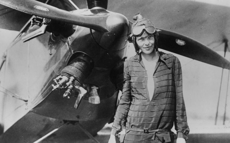 Amelia Earhart stands June 14, 1928, in front of her bi-plane called "Friendship" in Newfoundland.