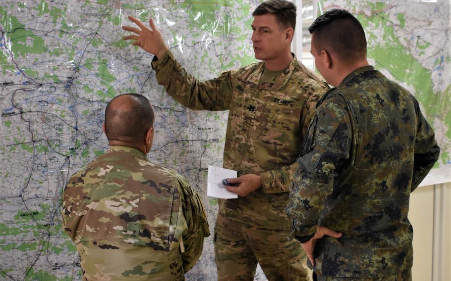 California National Guard leaders take part in a discussion about a field training exercise near Yavoriv, Ukraine, Sept. 21, 2019, during the multilateral annual Rapid Trident drills.