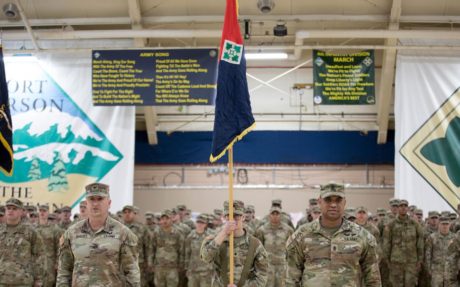 Friends and family of 2nd Stryker Brigade Combat Team, 4th Infantry Division soldiers watch as their Mountain Warrior soldiers stand in formation at a welcome-home and uncasing ceremony at Fort Carson, Colo., Tuesday, March 5, 2024.