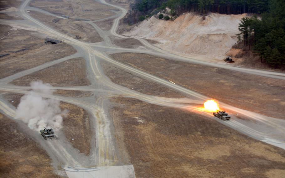 A South Korean K1A2 main battle tank fires a round during the Warrior Shield exercise at Rodriguez Live Fire Complex in Pocheon, South Korea, Wednesday, March 22, 2023.