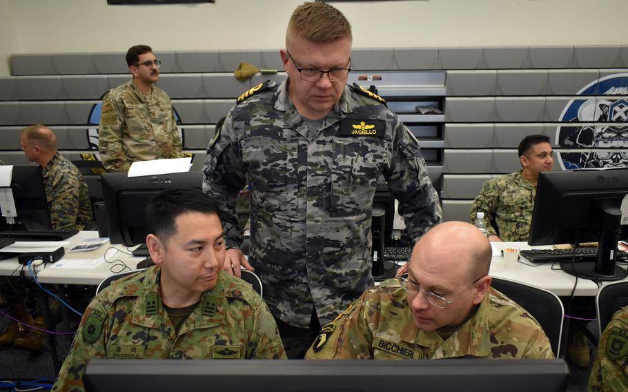 Service members from the United States, Japan and Australia work together during the Keen Edge exercise at Yokota Air Base, Japan, Feb. 1, 2024. 