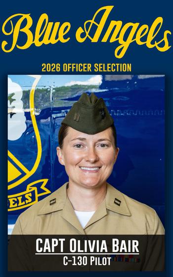 A service member smiles for a photo