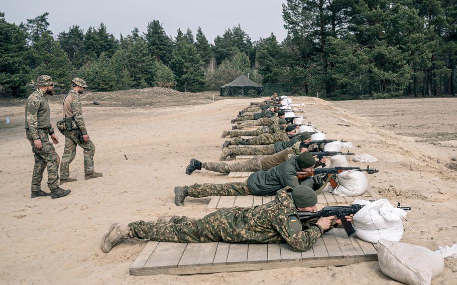 Recruits attend shooting practice at an Azov Brigade training camp outside Kyiv on March 24.