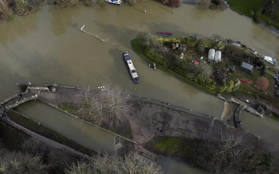 A narrow boat sits in the floods of the river Thames in Oxford, England, Sunday, Jan. 7, 2024. Europe is the fastest-warming continent and its temperatures are rising at roughly twice the global average, two top climate monitoring organizations reported Monday, April 22, 2024.