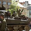 World War II reenactors wave from a tank to crowds during the parade May 4, 2025, at the Pilsen Liberation Festival in Pilsen, Czech Republic, commemorating the 80th anniversary of the city's World War II liberation.