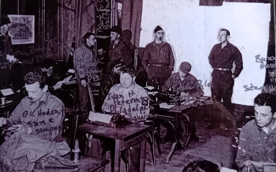 An undated photo shows, at center, war correspondents G.K. Hodenfield of Stars and Stripes, Yvan H. Peterman of the Philadelphia Inquirer and Ernie Pyle of Scripps Howard as they work on their stories at Chateau Vouilly, Normandy, France, in June 1944. The map behind them was redacted in the original photo to protect then-confidential information on troop movements. The chateau served as the first Allied press camp following the D-Day invasion.