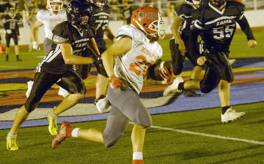 Nile C. Kinnick running back Branden Euceda outruns Zama defenders en route to 159 yards and three touchdowns on 21 carries.