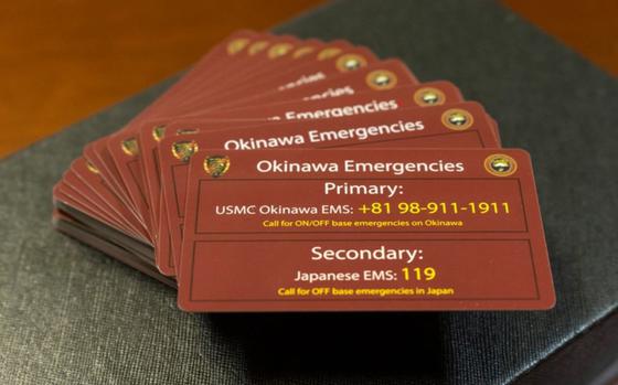 Emergency services cards  on display on Camp Courtney, Okinawa, Japan, Aug. 8, 2023. 