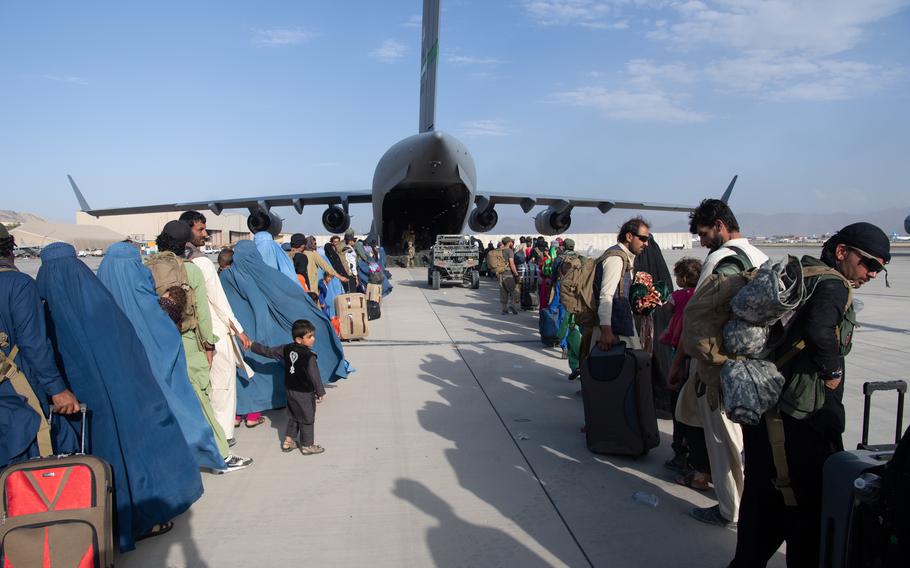 U.S. Air Force loadmasters and pilots assigned to the 816th Expeditionary Airlift Squadron, load passengers aboard a U.S. Air Force C-17 Globemaster III in support of the Afghanistan evacuation at Hamid Karzai International Airport, Afghanistan, Aug. 24, 2021.