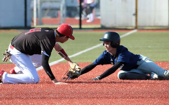 Kinnick third baseman Aaden Otteson applies the tag to St. Mary's baserunner Ty Tamagawa.