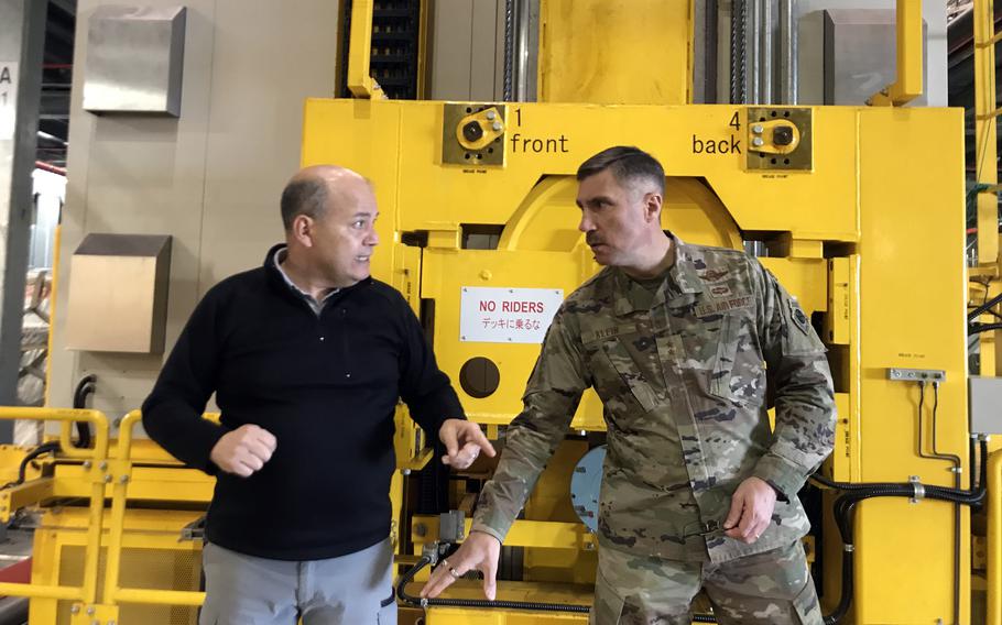 Air Force Expeditionary Center commander Maj. Gen. John Klein, right, visits with air terminal manager Ernie Weber at Yokota Air Base, Japan, Monday, Feb. 20, 2023.