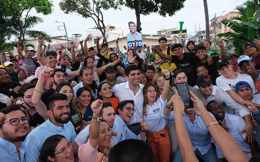 Ecuadoran presidential candidate Otto Sonnenholzner takes a group photo with supporters in Guayaquil on Tuesday, Aug. 15, 2023.