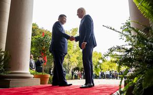 FILE -President Joe Biden, right, greets China's President President Xi Jinping, left, at the Filoli Estate in Woodside, USA, Wednesday, Nov. 15, 2023. High-level envoys from the United States and China are set to meet in Geneva for talks about artificial intelligence including the risks of the technology and ways to set shared standards to manage it. The meeting Tuesday is billed as an opening exchange of views in an inter-governmental dialogue on AI agreed during a meeting between U.S. President Joe Biden and Chinese President Xi Jinping in San Francisco. (Doug Mills/The New York Times via AP, Pool, File)