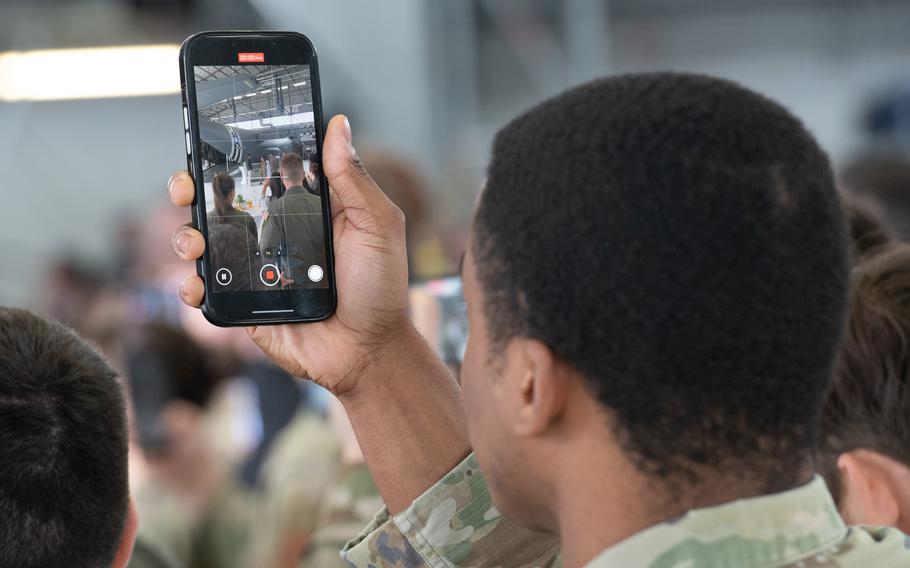 A U.S. service member records a video of Vice President JD Vance