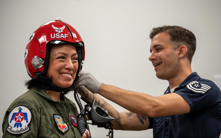 Teresa Chrapkiewicz, Thunderbirds’ Hometown Hero, left, gets fitted for her flight helmet with the help of Tech Sgt. Brandon Butler, during the Charleston Airshow at Joint Base Charleston, S.C., Friday, April 19, 2024. Chrapkiewicz is a teacher, published author, Air Force veteran, community volunteer and the first female Navajo pilot. The Hometown Hero program recognizes individuals who leave a profound and positive impact on their community, giving them an opportunity to ride in the back of an F-16 Fighting Falcon.  