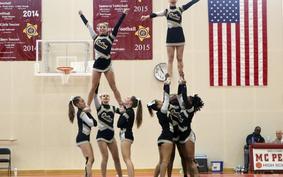 Far East Division I cheerleading champion Kadena forming double pyramids.