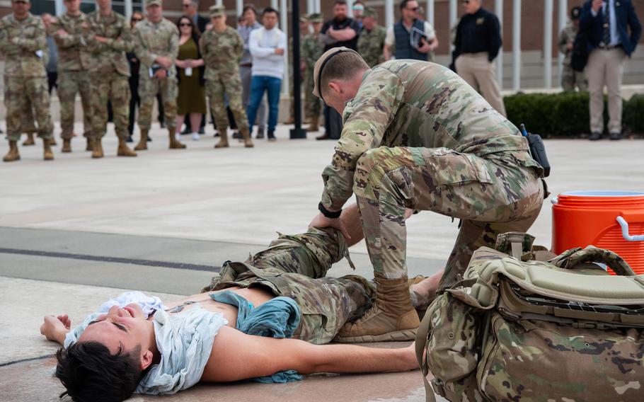 Soldiers with the Army’s 4th Airborne and Ranger Training Brigade demonstrate ice sheeting to rapidly cool a service member experiencing a suspected heat injury during the Army Heat Forum at Fort Moore, Ga., on Wednesday, Feb. 28, 2024.