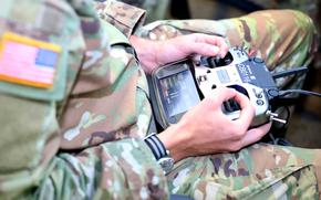 A soldier in the inaugural Unmanned Advanced Lethality Course at Fort Rucker, Ala., operates a commercial drone simulator controller in August 2025.