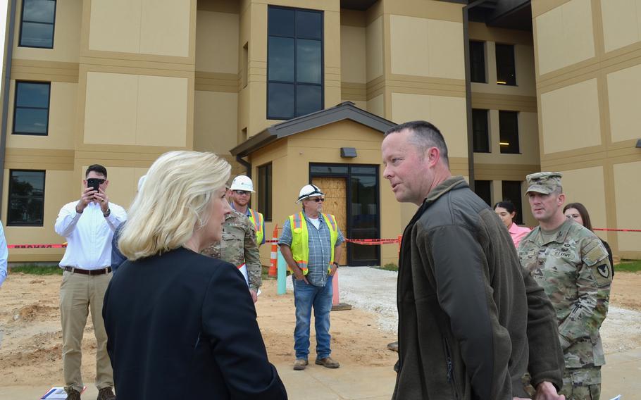 Russell Castillo, chief of engineering for the Directorate of Public Works at Fort Polk, La., discussed barracks renovations with Army Secretary Christine Wormuth during her tour on Tuesday, April 25, 2023, of quality-of-life facilities at the post. 