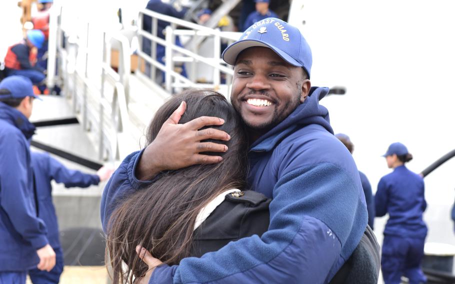 A USCGC Hamilton crew member reunites with his wife at the pier in North Charleston, S.C., Dec. 21, 2022. Hamilton completed a 94-day deployment in the Baltic Sea in support of U.S. 6th Fleet.