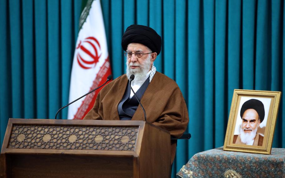 In this photo released by the official website of the office of the Iranian supreme leader, Supreme Leader Ayatollah Ali Khamenei speaks in a televised New Year speech, in Tehran, Iran, Monday, March 21, 2022. Khamenei signaled support for Tehran’s nuclear negotiations to secure sanctions relief, a rare reference to the still-halted talks as world powers near a diplomatic turning point. A portrait of the late Iranian revolutionary founder Ayatollah Khomeini displayed at right. 