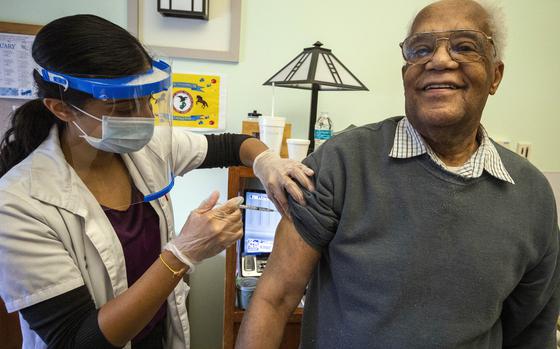 Carl Wilson receives the COVID-19 vaccination at the New Jersey Veterans Memorial Home at Menlo Park, Edison, N.J., in January 2021. The early and rapid rollout of coronavirus vaccines by the Veterans Health Administration saved hundreds of lives and provided robust protection in the diverse, older veterans community, a study says. 