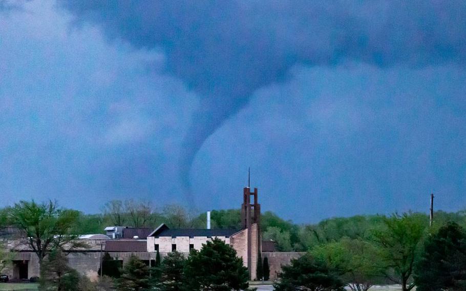 A tornado can be seen passing though Andover, Kansas, from K-96 on Friday, April 29, 2022.