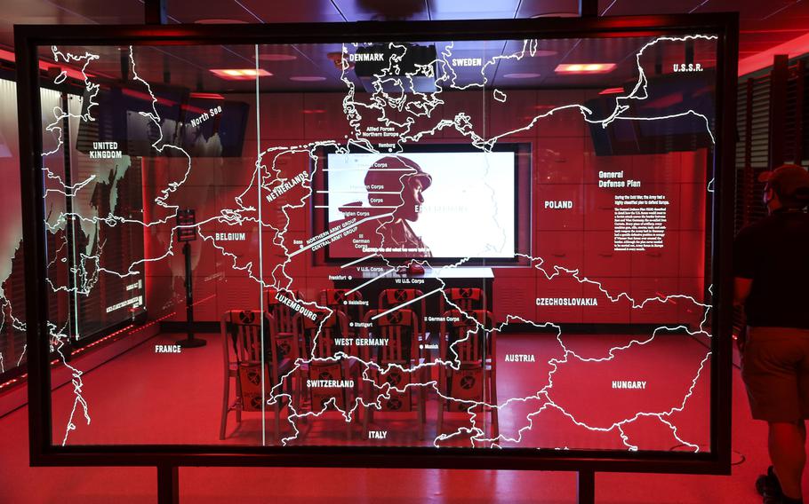 A video plays behind a map of Europe in the Cold War exhibit at the National Museum of the United States Army on its reopening day, June 14, 2021.