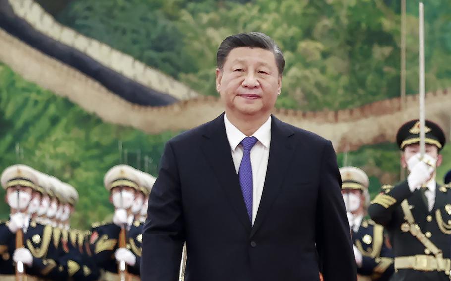 Chinese President Xi Jinping walks during a ceremony at the Great Hall of the People in Beijing on Nov. 28, 2022.