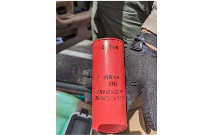 A member of the Santa Cruz County Sheriff’s Office Bomb Squad holds a military-grade incendiary thermite grenade. The Santa Cruz Police Station and a nearby corner were closed while the situation was being resolved.