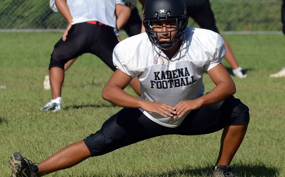 Kadena senior Sho Davenport stretches it out during warmups.