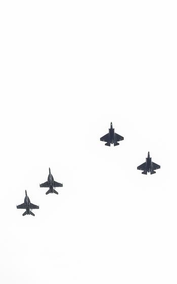 Aircraft from Strike Fighter Squadrons 125 and 151 conduct a flyover at retired Lt. Cmdr. Lou Conter’s memorial service in Grass Valley, Calif., Tuesday, April 23, 2024. 