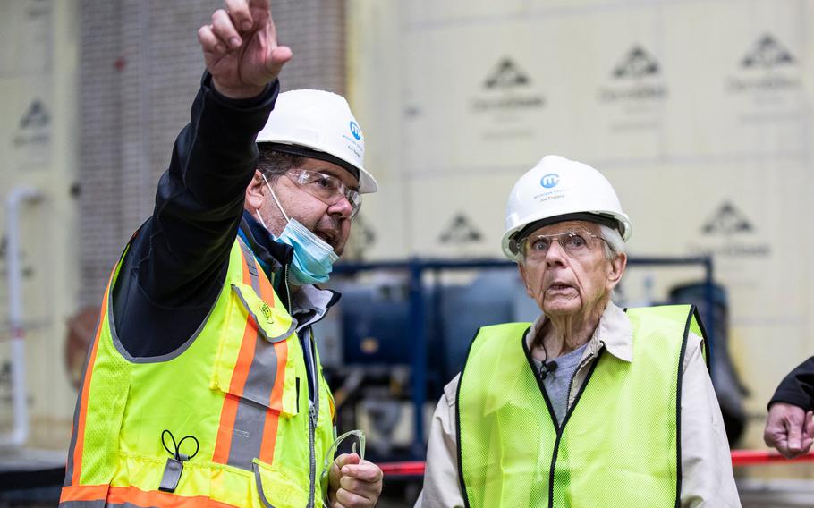 Michigan Central construction manager Richard Bardelli, left, guides George England for a tour inside Michigan Central Station in Detroit on Sept. 25, 2021.