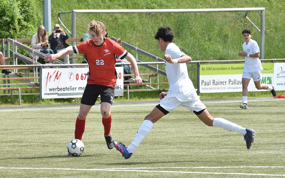 American Overseas School of Rome forward Riley Smith tries to get by Vicenza defender Brandon Prado during a Division II semifinal at the DODEA European soccer championships on May 17, 2023, at VfR Baumholder's stadium in Baumholder, Germany.