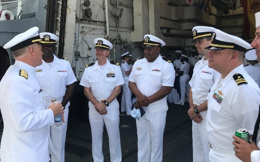 Vice Adm. Gene Black, commander of U.S. 6th Fleet, left, speaks with chaplains assigned to Destroyer Squadron 60 during a change-of-command in Rota, Spain, Aug. 10, 2021. 