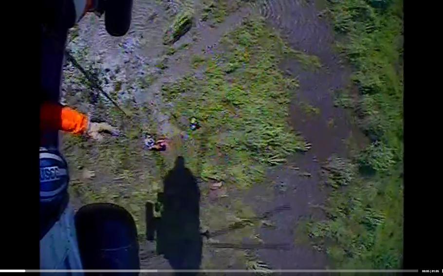 The U.S. Coast Guard released video Saturday of one of its helicopter crews hoisting survivors of a plane crash by the Tar River near Greenville, N.C.