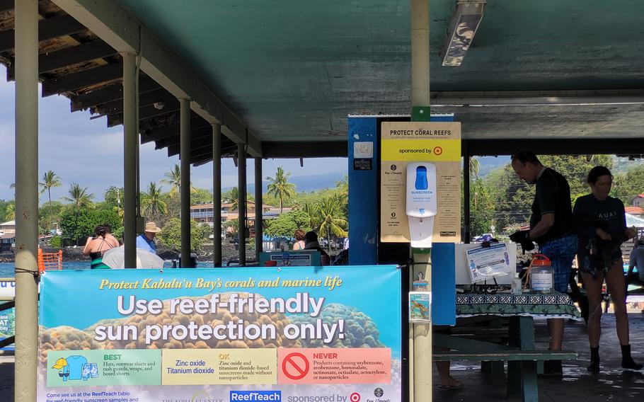 One way to help protect coral reefs is to choose sunscreen products without oxybenzone, such as Raw Elements, which is available in dispensers at Kahaluu Beach Park in Hawaii. 