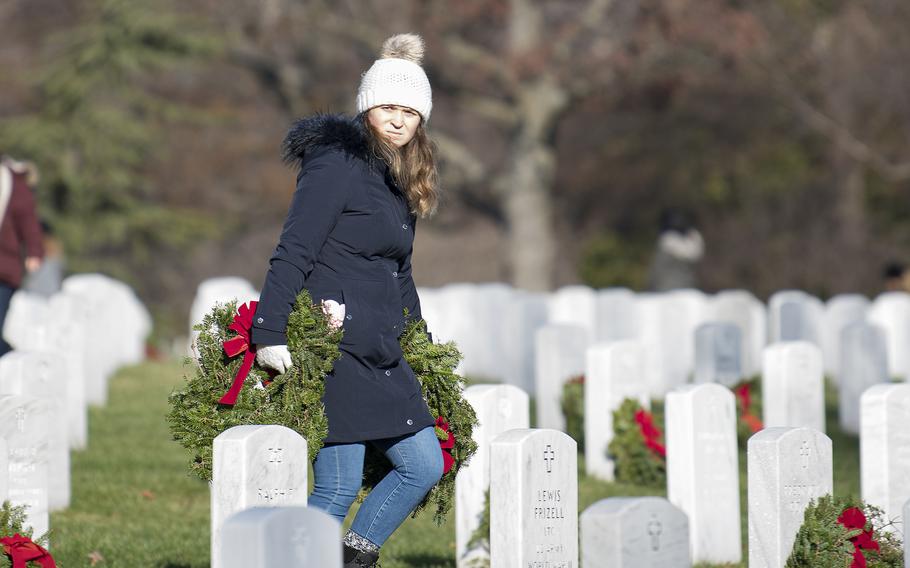 Tens of thousands of volunteers helped place more than a quarter-million wreaths at Arlington National Cemetery on Saturday, Dec. 17, 2022.