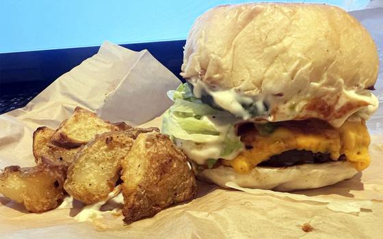 The hot avocado burger from Superiorty Burger in Tokyo is topped with vegan cheese, avocado, mustard, delicious vegan mayo and just the right amount of peppers.