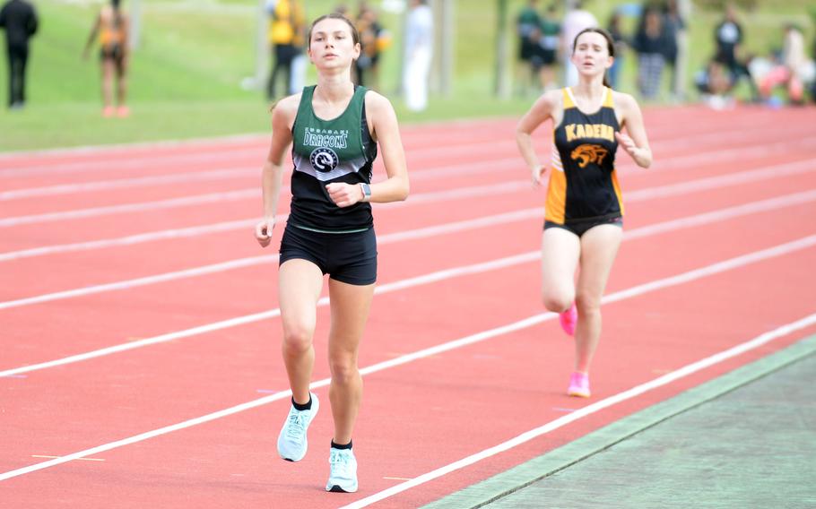 Kubasaki's Jada Laurin heads for the finish ahead of Kadena's Kyleigh Darrow in the 1,600 during Saturday's Okinawa track and field meet. Laurin won the event and Darrow came in second.