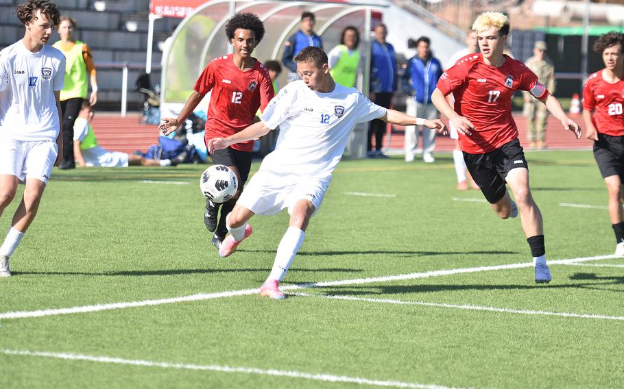 Wiesbaden's Liam Ho gets the ball away before the Kaiserslautern defense can converge Monday, May 19, 2025, at the DODEA-Europe boys Division I soccer championships in Kaiserslautern, Germany.