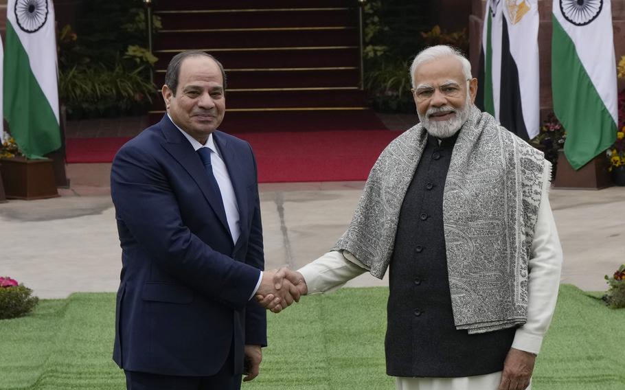 Indian Prime Minister Narendra Modi, right, shakes hand with Egyptian President Abdel Fattah El-Sisi before the start of their meeting in New Delhi, India, Wednesday, Jan. 25, 2023. (AP Photo/Manish Swarup)