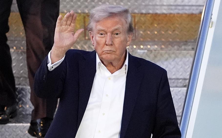 Trump waves.