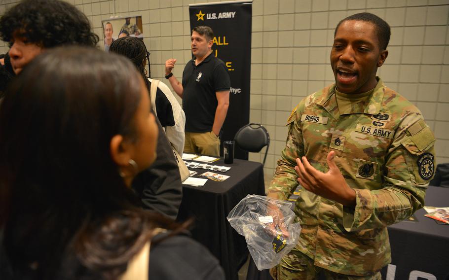 Staff Sgt. Noah Burris, a recruiter with the U.S. Army New York City Recruiting Battalion, discusses his experience in the service with Big Apple College Fair attendees on Oct. 8, 2023. 