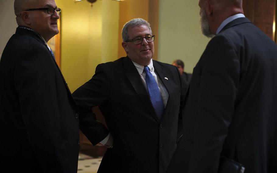 Auditor General Frank Mautino, center, appears in the Illinois State Capitol in Springfield on Jan. 29, 2020.