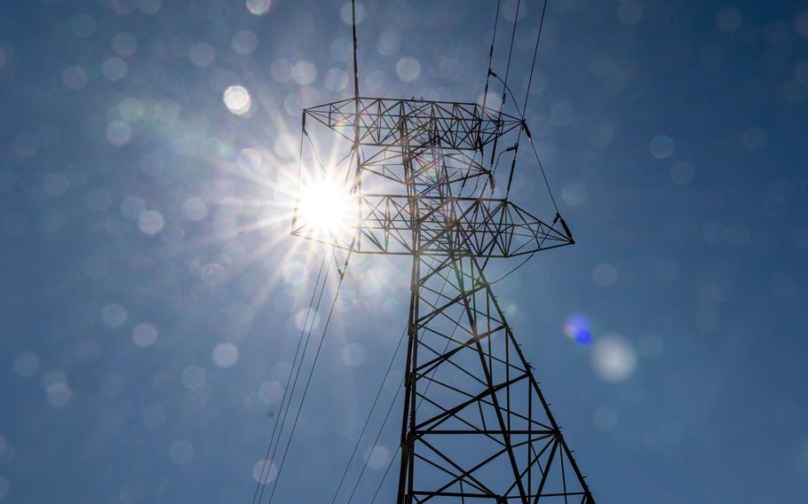 High voltage power lines in Pinole, Calif., on June 17, 2021.  California and neighboring states are facing another historic heat wave that may push power supplies to the brink and is adding to already high wildfire risk amid record drought.