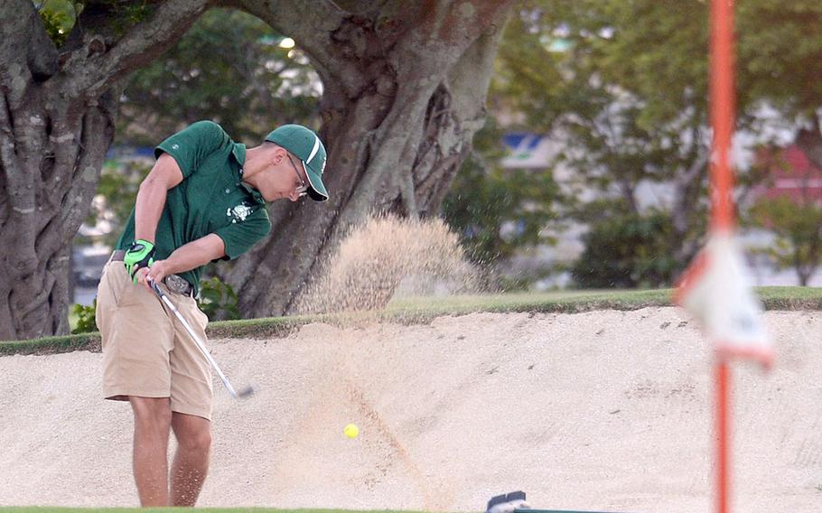 Kubasaki's Chett Huff hits out of a sand trap on the 14th hole, the first playoff hole.