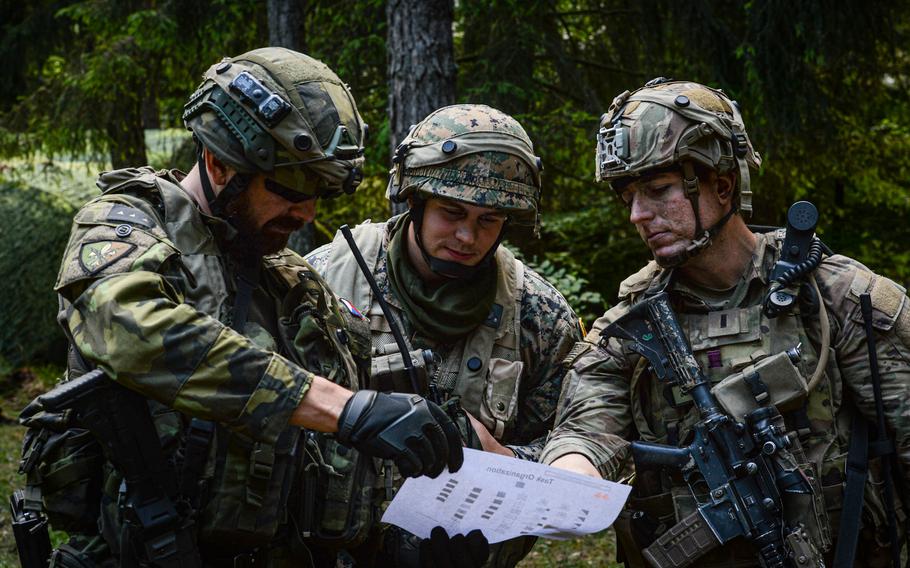 A Czech,  Bosnia and Herzegovina, and U.S. Army soldier guards a foward-positioned command post during exercise Combined Resolve at the Joint Multinational Readiness Center in Hohenfels, Germany, June 8, 2022. More than 5,000 U.S. service members, allies and partners from more than 10 countries, participated in integrated combat operations.