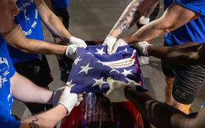 Marines fold the American flag