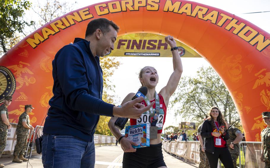 Anna Staats celebrates at the finish line